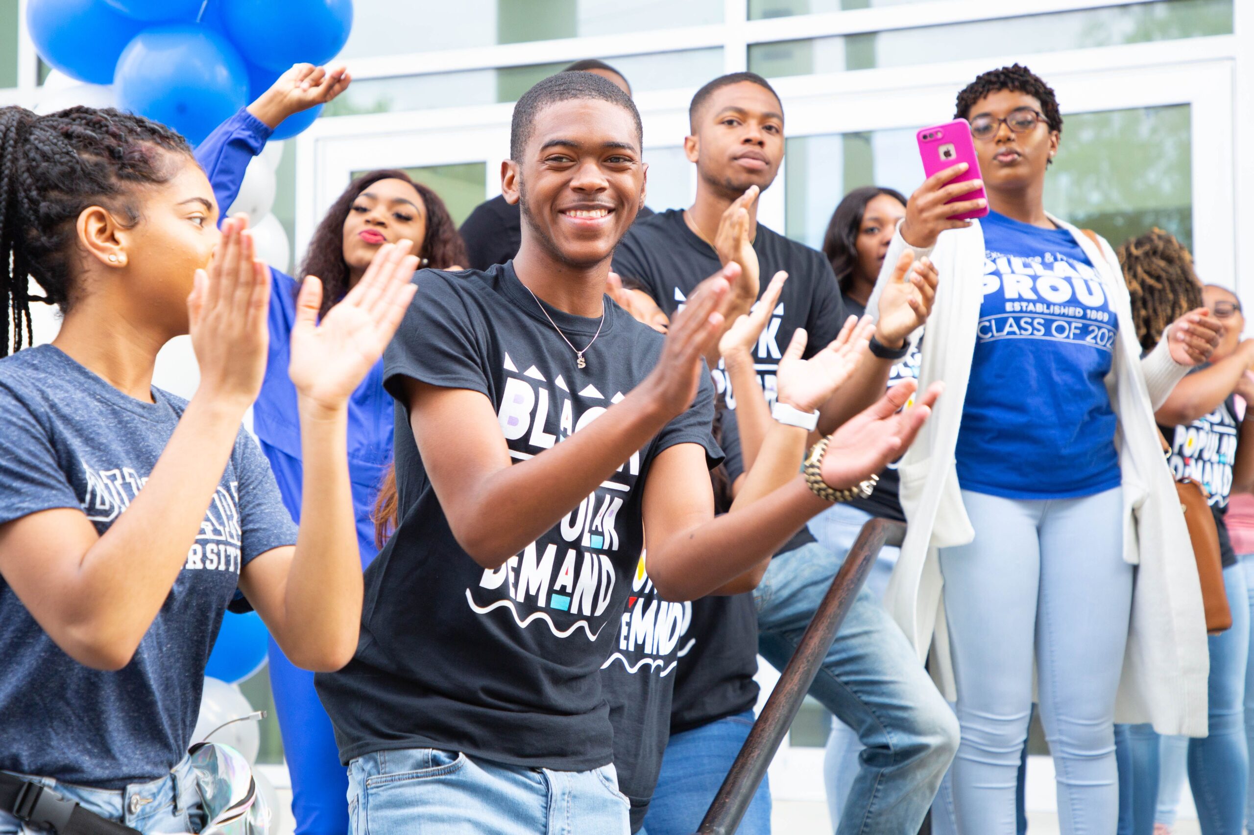 Dillard University student group outdoors clapping