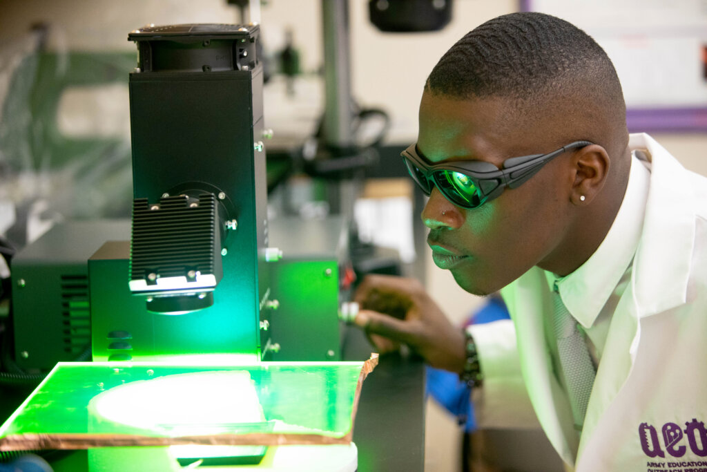 Dillard University Academics - student in physics class with microscope