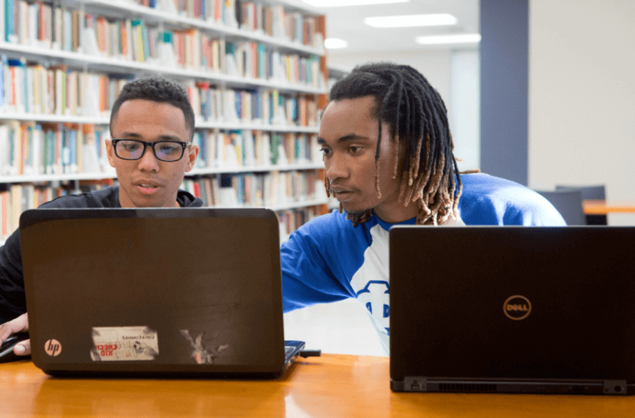two Dillard University students in library