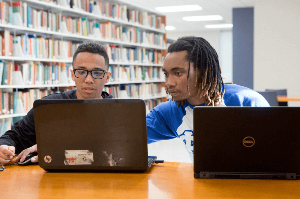 two Dillard University students in library