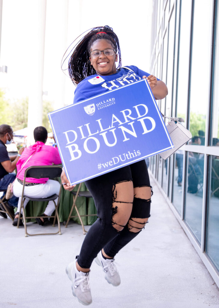 Dillard Bound - new student holding sign