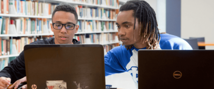 two Dillard University students in library
