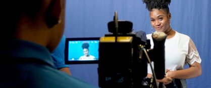 Dillard University female student with video camera.